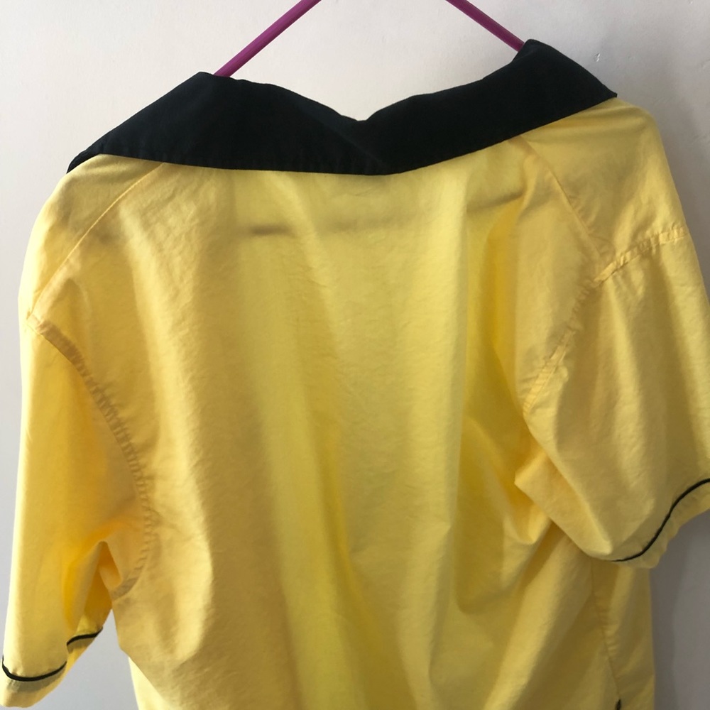 Yellow button up shirt
